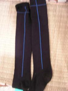 long black sock with one blue stripe
